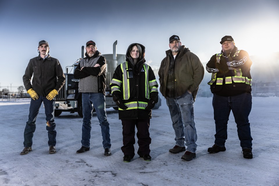 Scott "Scooter" Yuill, right, with other drivers in a promotional image for season 12 of Ice Road Truckers. Sean F White/Original Productions/The History Channel