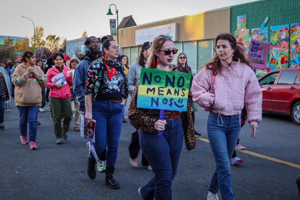 Take Back the Night marchers. Jasmine Nasogaluak/Cabin Radio