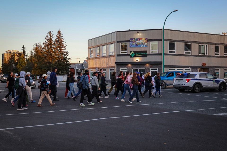 The Take Back the Night march heads through Yellowknife's downtown. Jasmine Nasogaluak/Cabin Radio