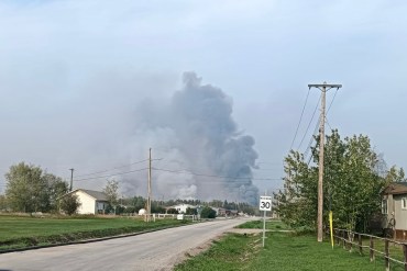 A photo published by Mayor of Fort Providence Danny Beaulieu shows smoke from a planned ignition near the community.