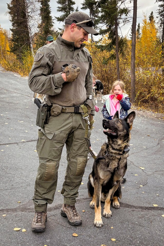 Cpl Terence Dunphy with police dog Rain. Jasmine Nasogaluak/Cabin Radio