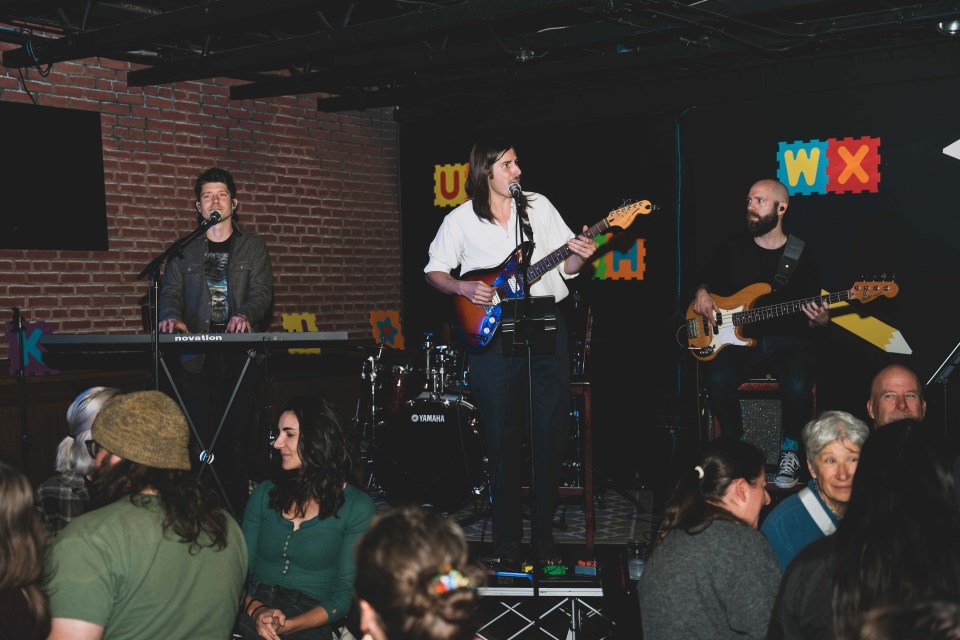 The Co-op band performs at the adult spelling bee event. Sarah Pruys/Cabin Radio