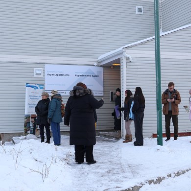 People at a tour of Aspen Apartments on November 27, 2025. Aastha Sethi/Cabin Radio