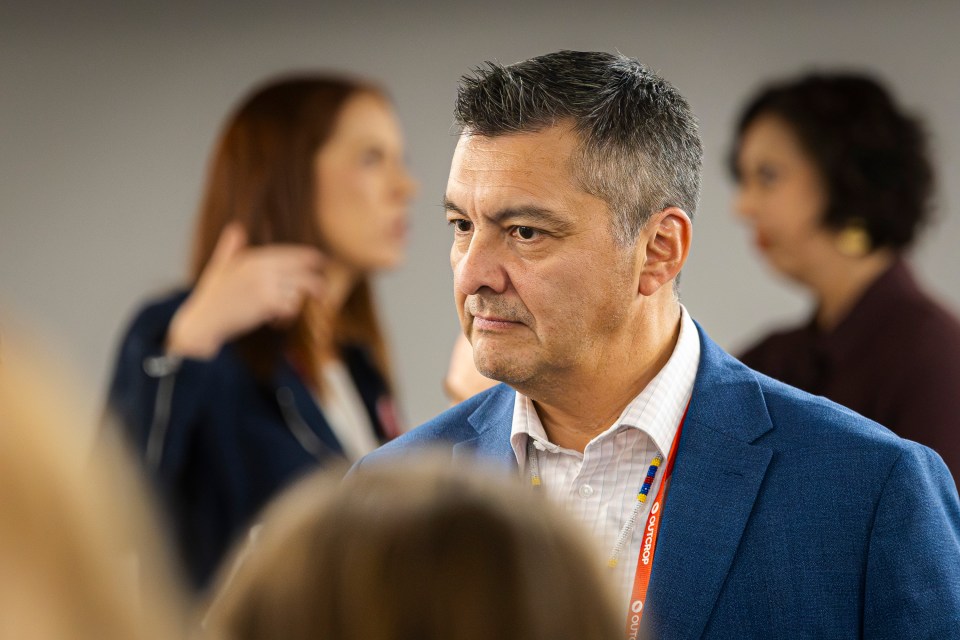 Tłı̨chǫ Grand Chief Jackson Lafferty (with NWT finance minister Caroline Wawzonek pictured back left) at the Yellowknife Geoscience Forum in November 2025. Ollie Williams/Cabin Radio