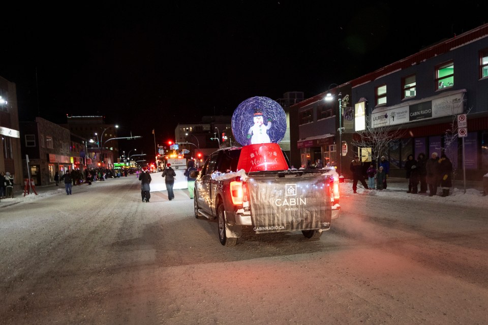 The snowglobe in the Cabin Radio float passes by the station's studios. Ollie Williams/Cabin Radio