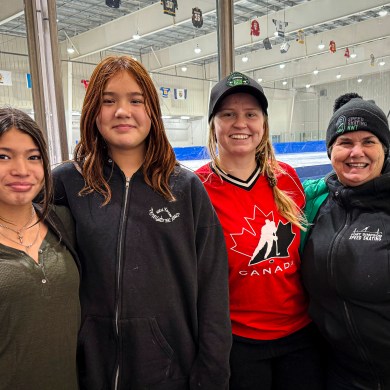 From left: Ember Sibbeston, Mia Hardisty-Atkins, Madison Pilling and Val Gendron at a speed skating competition in Yellowknife on November 29, 2025. Ollie Williams/Cabin Radio