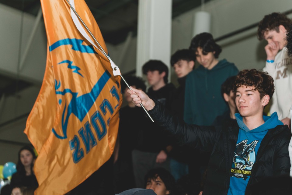 A Sir John's fan waves a Falcon's flag. Sarah Pruys/Cabin Radio