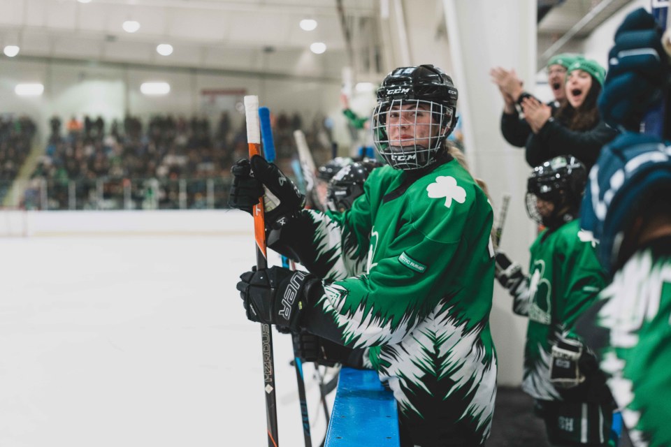 St Pats girls watch the game from the bench. Sarah Pruys/Cabin Radio