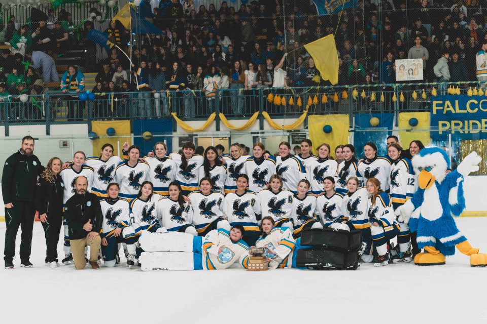 The Sir John girls with this year's Wade Hamer trophy. Sarah Pruys/Cabin Radio