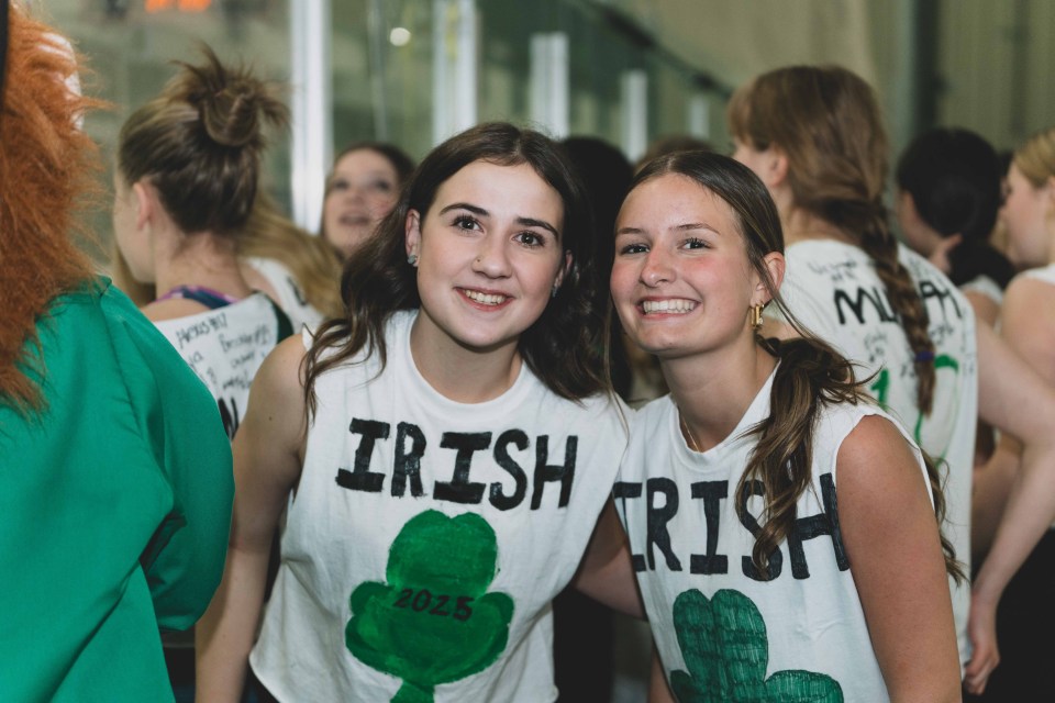 Girls from the St Pats hockey team cheer on the boys team, which played after them. Sarah Pruys/Cabin Radio