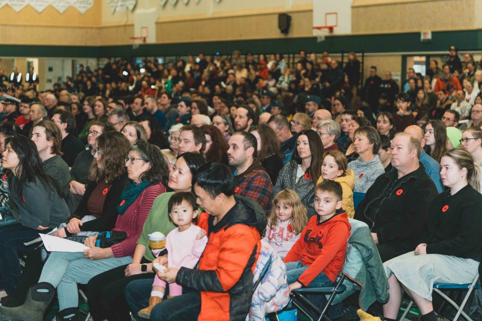 Yellowknife residents fill St Patrick High School's gym for the Remembrance Day indoor service. Sarah Pruys/Cabin Radio