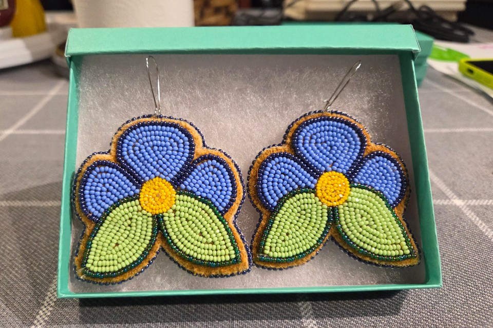"These blue flower earrings capture the serene beauty of nature. Inspired by wildflowers, their delicate petals mirror the calm of dewy grass at dawn, while the vibrant blue echoes the peaceful hues of the sky. Crafted with intricate detail, they symbolize nature’s quiet strength—fragile yet resilient. Wearing them is like carrying a piece of the earth’s untamed beauty, a reminder to stay grounded yet free to bloom wherever life leads," says Blake.