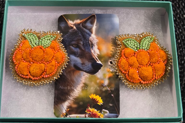 "These caribou-tufted earrings are inspired by yellow berries that brighten the landscape and signal the abundance of the natural world," writes Blake of these Golden Berries of the Land earrings. "The warm tones of the caribou tufts reflect ripened berries glowing against earth and sky, symbolizing nourishment, renewal, and connection to the land. Beaded on home-tanned, smoked moose hide, the earrings carry the strength, scent, and tradition of the land itself."
