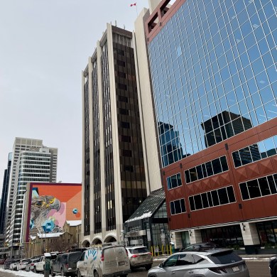 606 4 St SW in Calgary, centre, part of which serves as Burgundy's Canadian headquarters. Ollie Williams/Cabin Radio