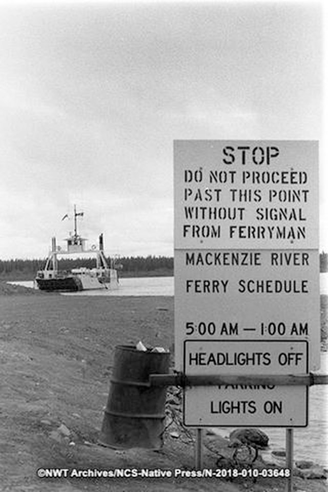 A sign at the Fort Providence ferry crossing. NWT Archives/Native Communications Society fonds - Native Press photograph collection/N-2018-010: 03648