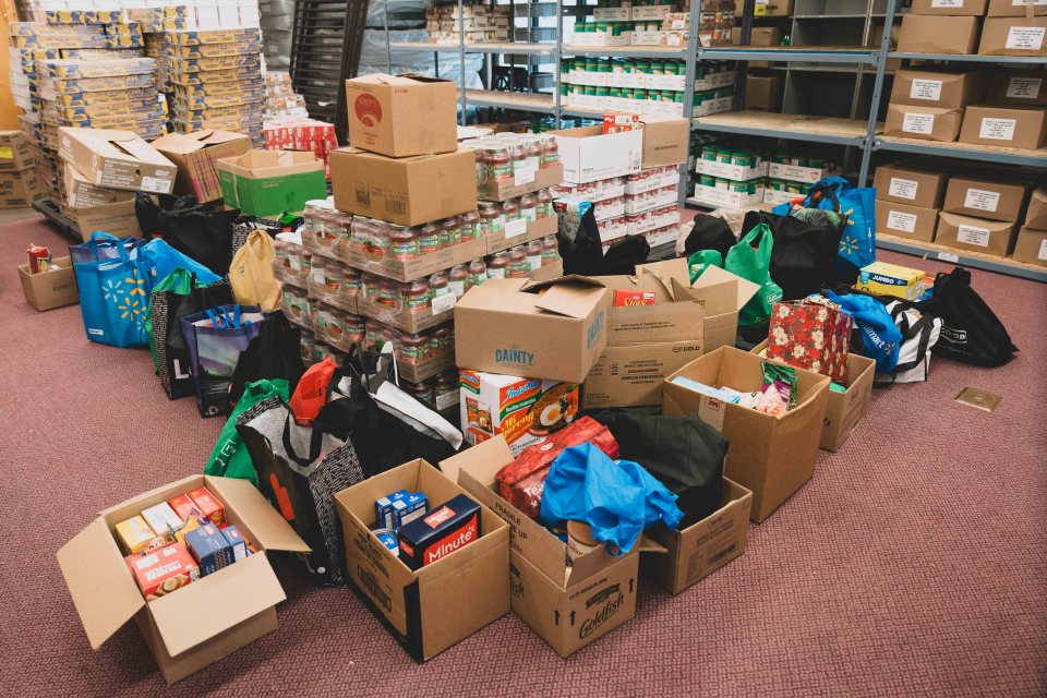 Food donations from St Pat's piled in boxes at the Salvation Army. Sarah Pruys/Cabin Radio