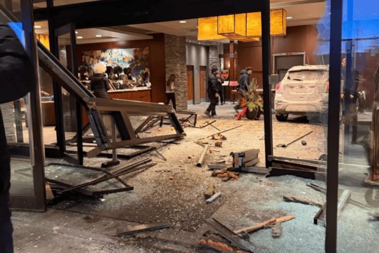 A submitted image of a car at rest inside the foyer of the Explorer Hotel.