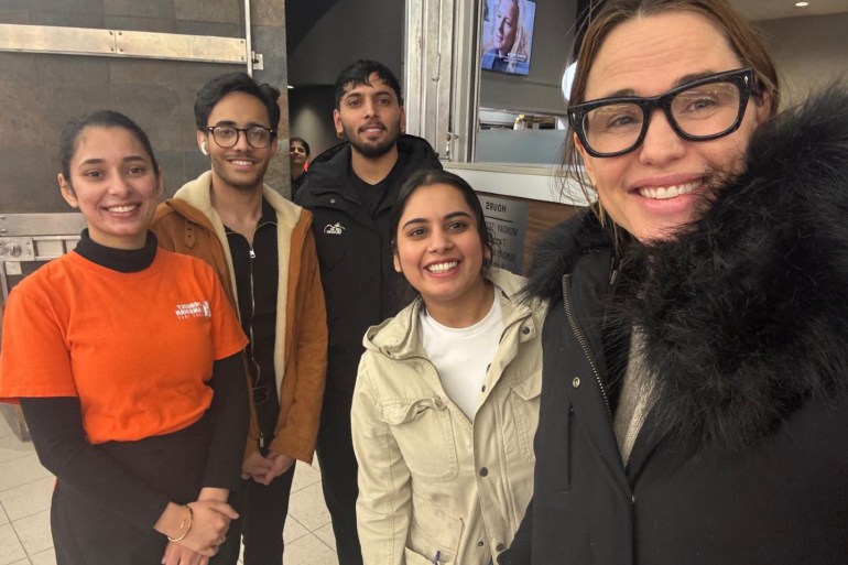 In a submitted photo, Ricky's staff pose alongside Jennifer Garner, right.