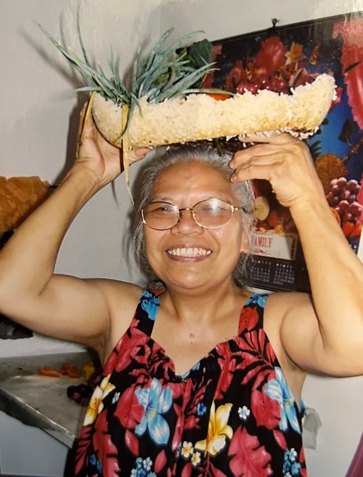 Juanita repurposing a fruit bowl made of rice as a hat. Photo submitted by Jovi Yip