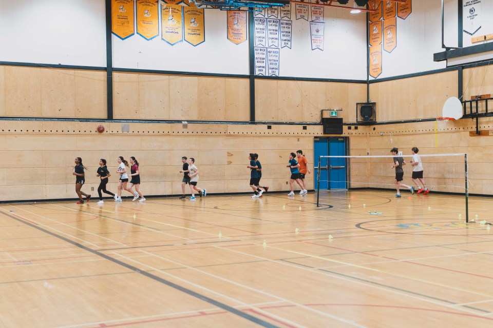 Badminton players run laps to warm up before tryouts at École Sir John Franklin High School. Sarah Pruys/City of Yellowknife