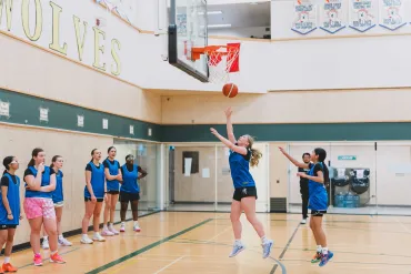 At female basketball trials, a player shoots the ball in a rapid two-on-two drill. Sarah Pruys/City of Yellowknife