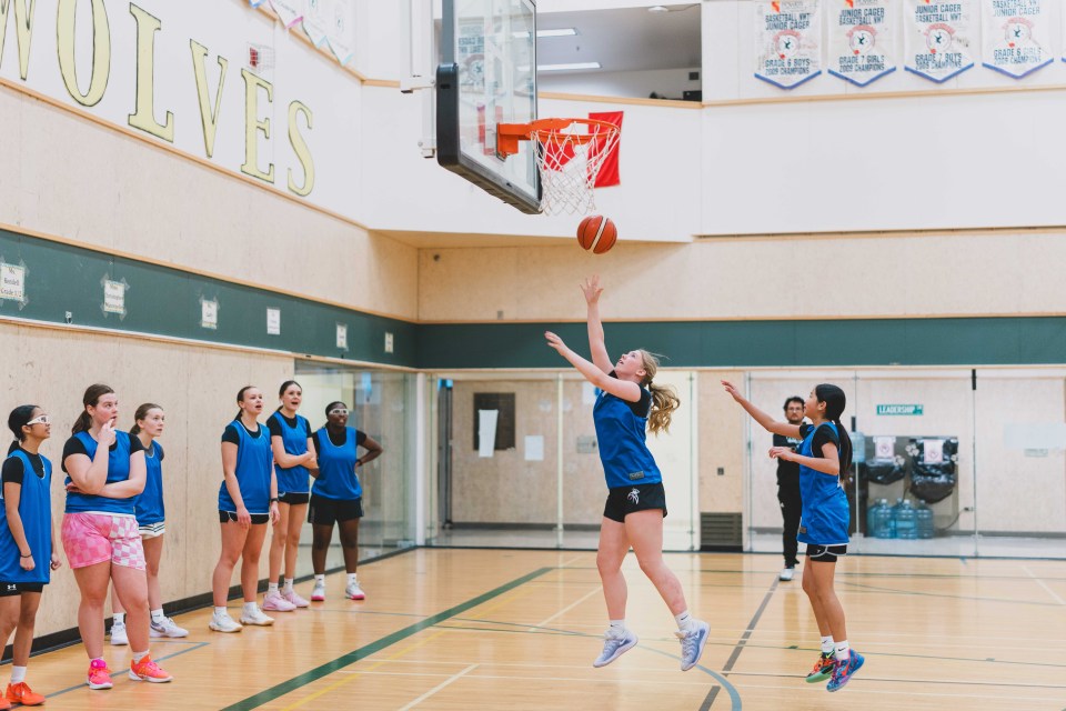 At female basketball trials, a player shoots the ball in a rapid two-on-two drill. Sarah Pruys/City of Yellowknife