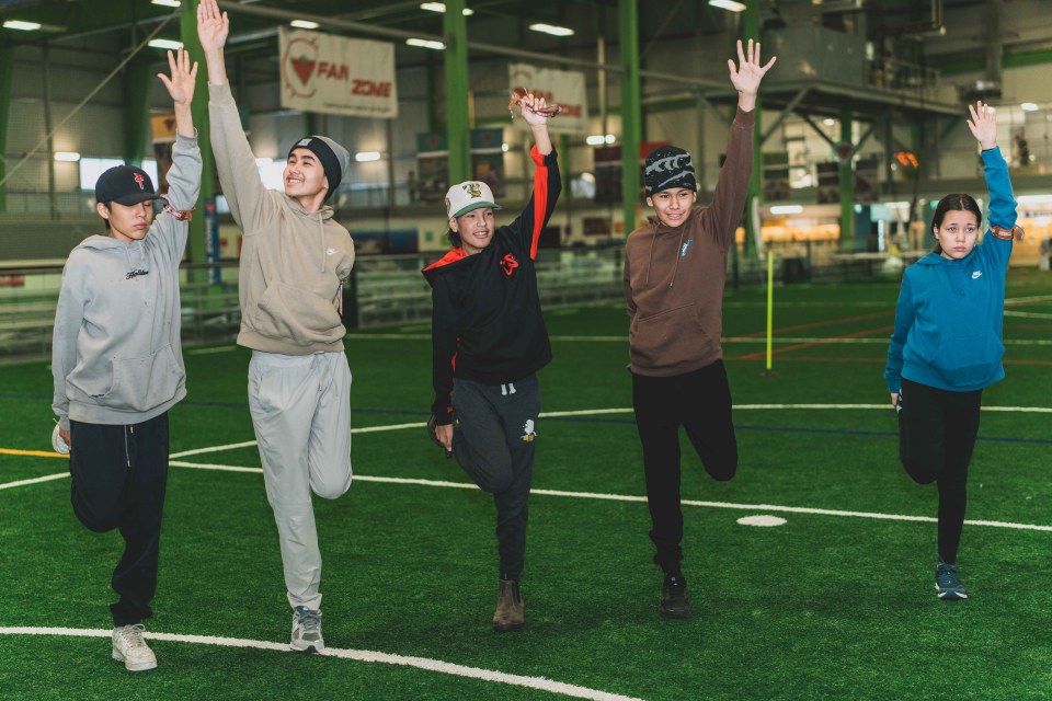 Biathletes stretch to warm-up. Sarah Pruys/City of Yellowknife