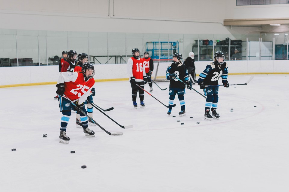 Female hockey team hopefuls practice drills. Sarah Pruys/City of Yellowknife