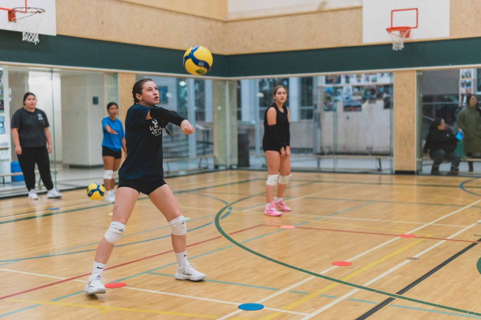 A players bumps a volleyball during trials for the female volleyball team. Sarah Pruys/City of Yellowknife
