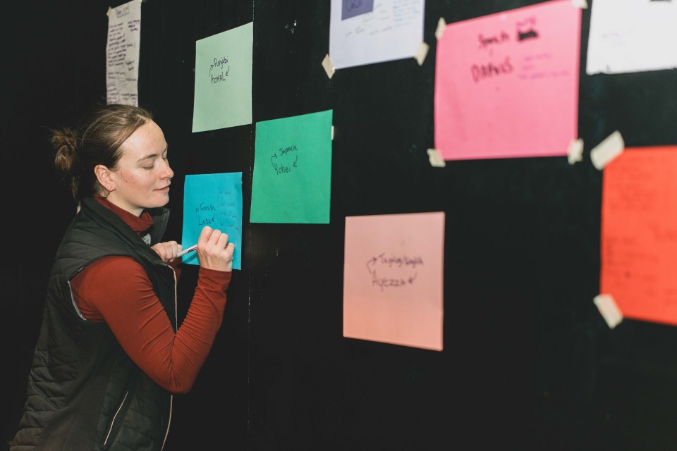 Fia Grogono makes a note following a dance to a Finnish voice note. Sarah Pruys/Cabin Radio