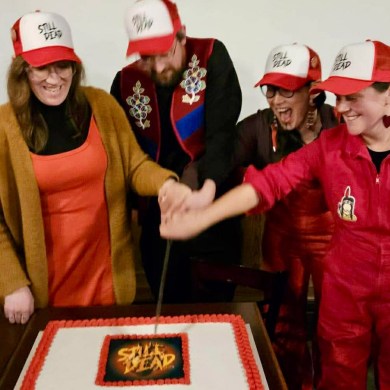 Still Dead organizers celebrate with a cake. Photo submitted by Killulark Arngna'naaq