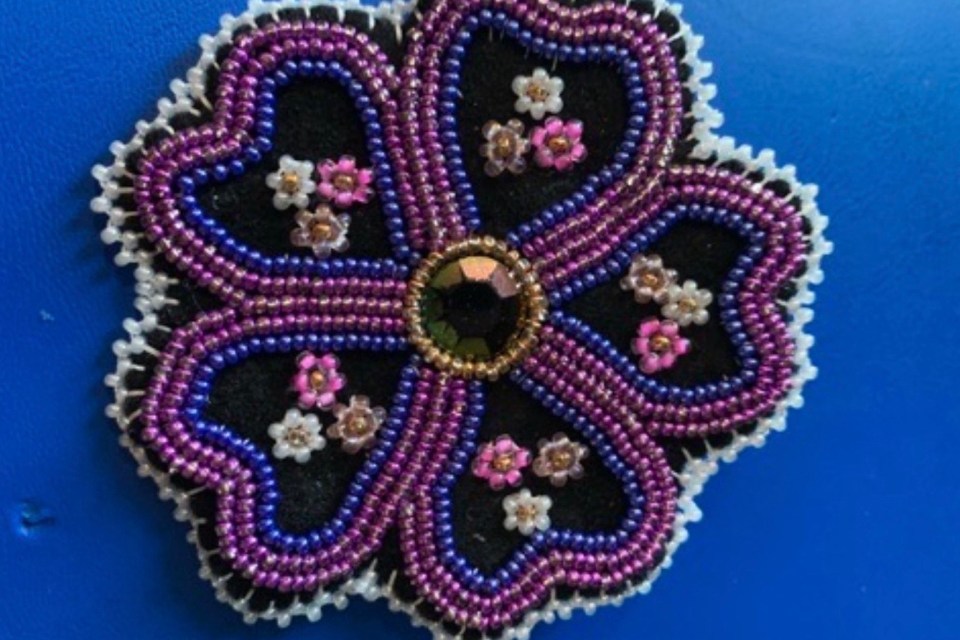 A beaded piece by Ashley Jacobson. Ashley Jacobson made these beaded mittens with sealskin and fox fur. A pair of beaded mittens made with sealskin and fox fur by Ashley Jacobson. Photo: Submitted