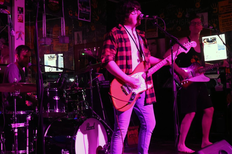 Band performs on stage