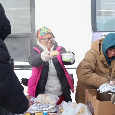 Yellowknife Street Support Network members served soup and bannock to residents on Friday. Aastha Sethi/Cabin Radio