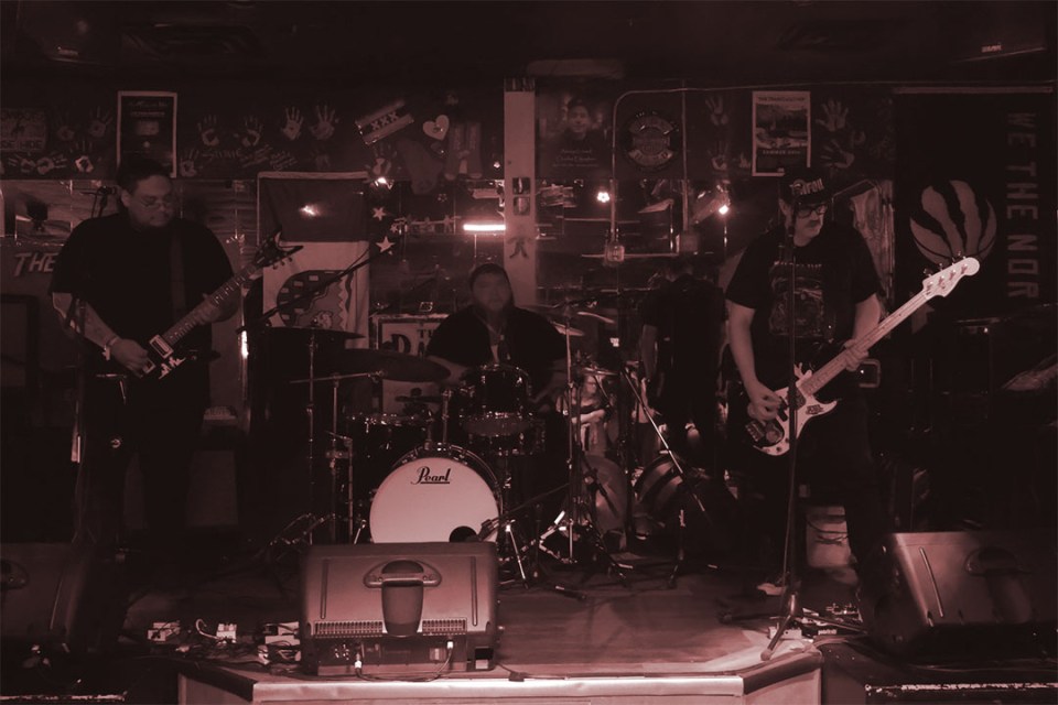 people on stage with instruments