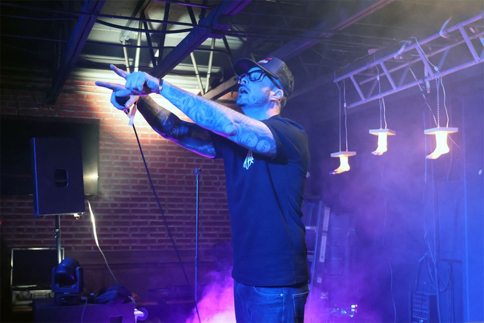 Man on stage points at the crowd