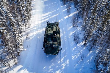 An armoured vehicle on a portage north of Yellowknife during an Operation Nanook-Nunalivut training exercise on February 19, 2026. Ollie Williams/Cabin Radio