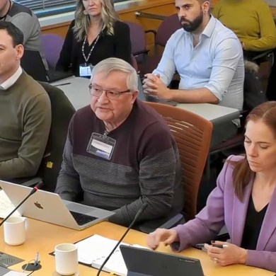 Jake Heron, front centre, flanked by Andrew Stewart to the left and Caroline Wawzonek to the right.