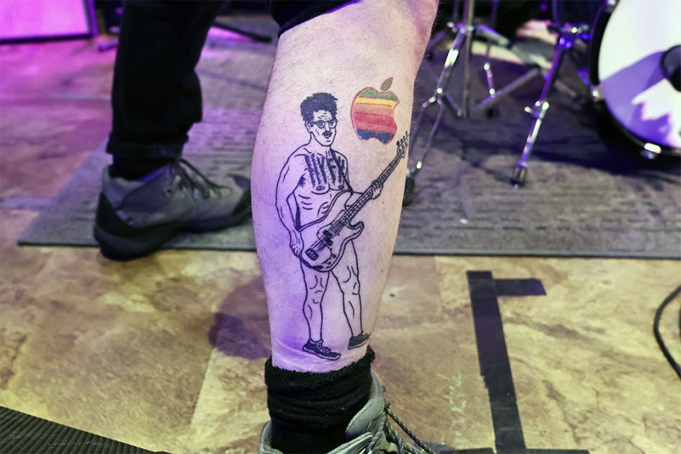 Close-up a tattoo of a band member on his leg