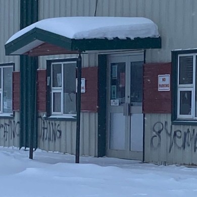 Graffiti outside the Acho Dene Koe First Nation office in Fort Liard appears to read "eight years of nothing." Photo: Submitted