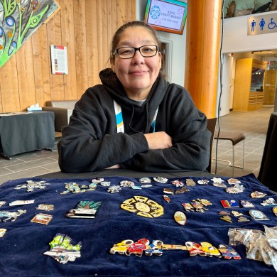Debora Heron with her 2026 Arctic Winter Games pins. Ollie Williams/Cabin Radio