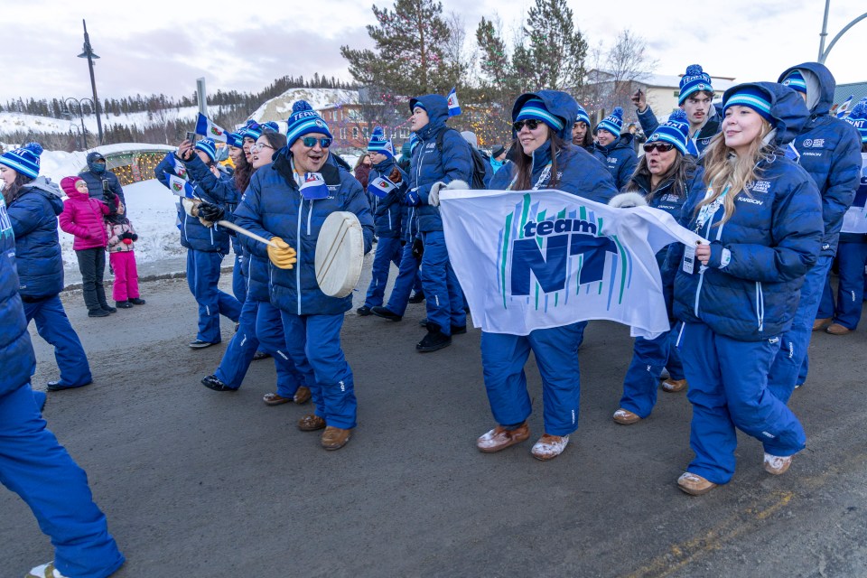 Drummers and the flags of multiple Indigenous nations were represented in the Team NT ranks and those of other contingents. Ollie Williams/Team NT