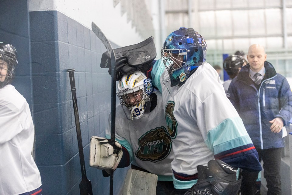 Starting goaltender Ryder Lee is congratulated by team-mate Jack Walsh after an impressive second period against Yukon on Tuesday. Ollie Williams/Team NT