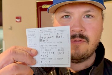 Jesse Wheeler with tickets for the last screening at Yellowknife's Capitol Theatre on March 31, 2026. Ollie Williams/Cabin Radio