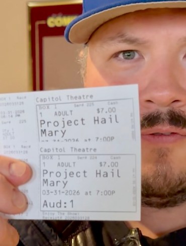 Jesse Wheeler with tickets for the last screening at Yellowknife's Capitol Theatre on March 31, 2026. Ollie Williams/Cabin Radio