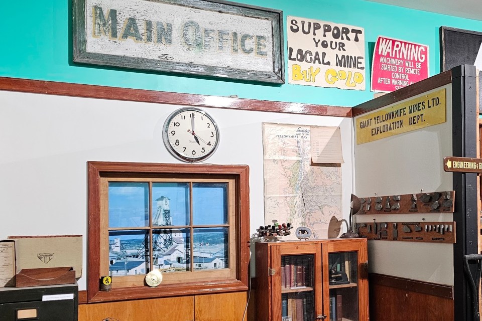 A clock on the wall of a Giant Mine-related display at the Yellowknife Historical Museum. Ollie Williams/Cabin Radio
