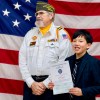 Sebastian Bernabe, right, holds a certificate after placing second in the Patriot's Pen program. Photo: Submitted
