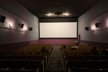 Audience members begin to fill screen two of Yellowknife's Capitol Theatre on its final night in business. Ollie Williams/Cabin Radio