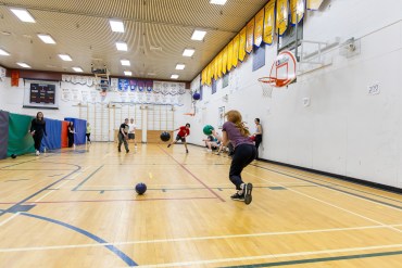 Melissa Clark is bombarded by members of Teach and Destroy. Ollie Williams/Cabin Radio