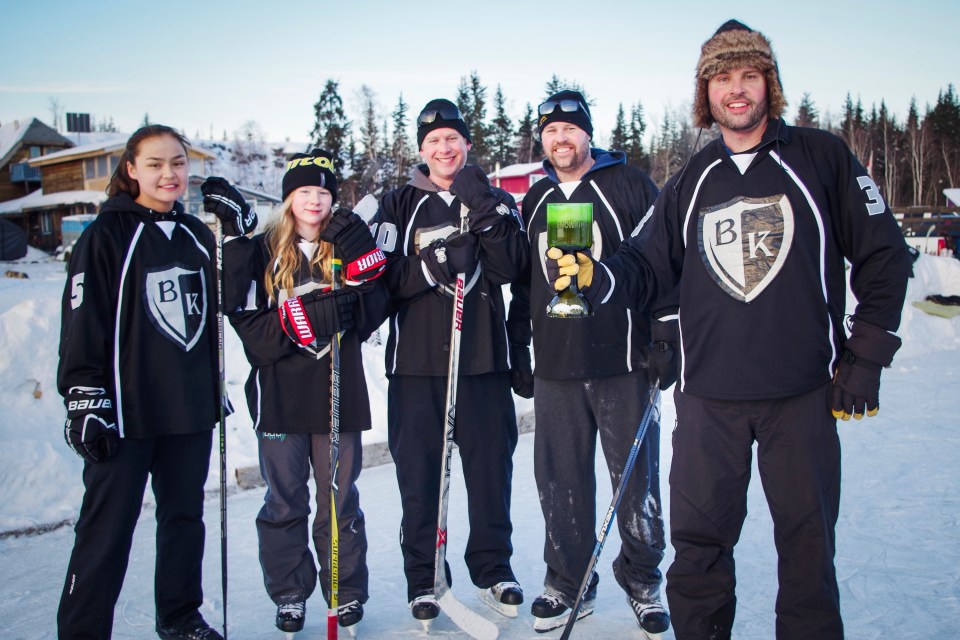 A Black Knight-sponsored pond hockey team with the Snowking Cup in years gone by. Photo submitted by Mike Mitchell via Craig Scott